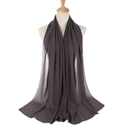 Dark gray scarf on a mannequin with a white background