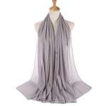 Gray scarf on a mannequin with a white background