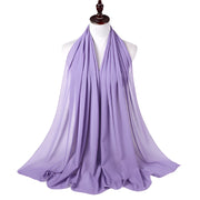 Lavender scarf on a mannequin against a white background