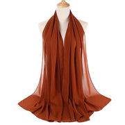 Brown scarf on a mannequin with a white background