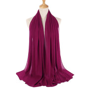 Purple scarf on a mannequin with a white background