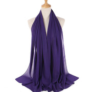 Purple scarf on a mannequin with a white background