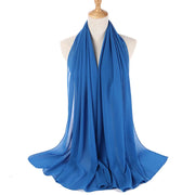 Blue scarf on a mannequin with a white background