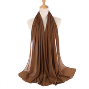 Brown scarf on a mannequin with a white background