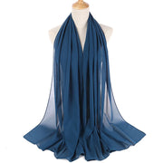 Blue scarf on a mannequin with a white background