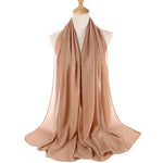 Beige scarf on a mannequin with a white background